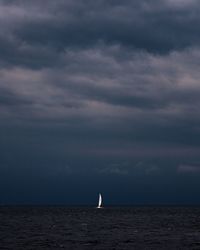 Scenic view of sea against sky at dusk