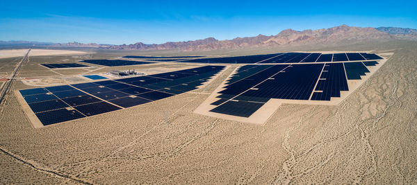 Solar panel produces green, environmentaly friendly energy from the setting sun. aerial view 