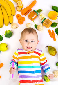 High angle view of cute girl playing with toys on table