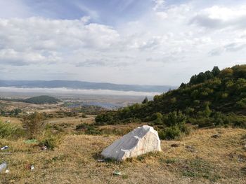 Scenic view of landscape and mountains against sky