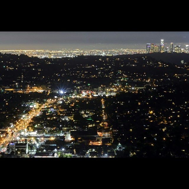 night, illuminated, cityscape, city, building exterior, architecture, built structure, crowded, aerial view, high angle view, city life, residential district, skyscraper, sky, clear sky, modern, residential building, no people, water, light