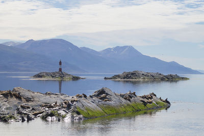 Scenic view of lake and mountains against sky