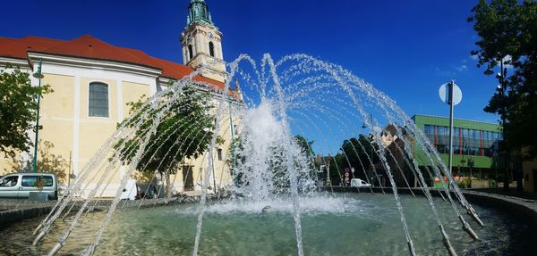 Fountain with buildings in background