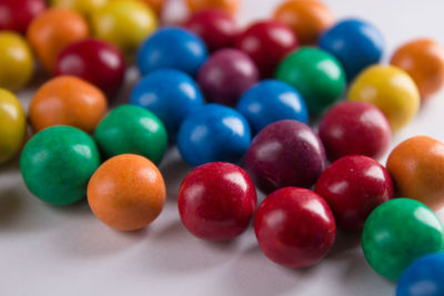 Close-up of multi colored candies on table