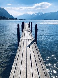 Pier over lake against sky