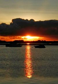 Scenic view of lake against romantic sky at sunset