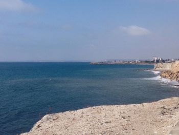 Scenic view of sea against blue sky