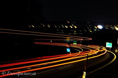 Light trails on road at night
