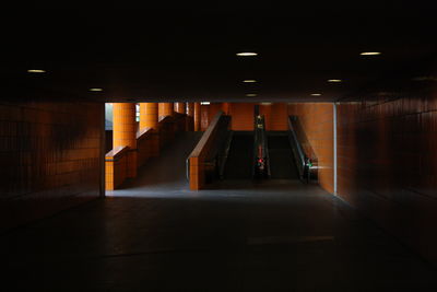 Empty illuminated corridor at night