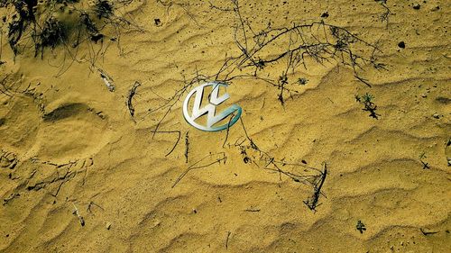 High angle view of footprints on sand