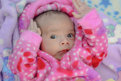 Cute baby relaxing on bed