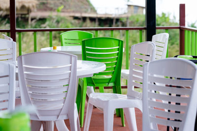 Empty chairs and tables in restaurant