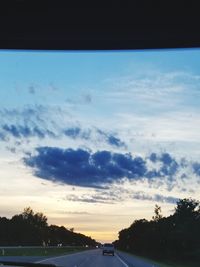 Scenic view of silhouette trees against sky at sunset