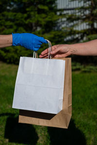 Cropped image of hand holding paper