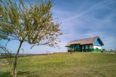 House on field against sky