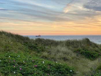 Scenic view of sea against sky during sunset