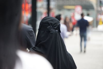 Rear view of woman in hijab on street