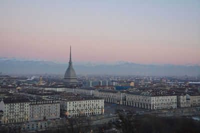 High angle view of city buildings during sunset