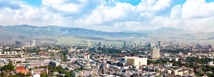 Panoramic view of cityscape against sky