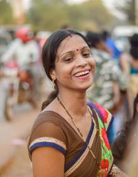 Portrait of a smiling young woman outdoors