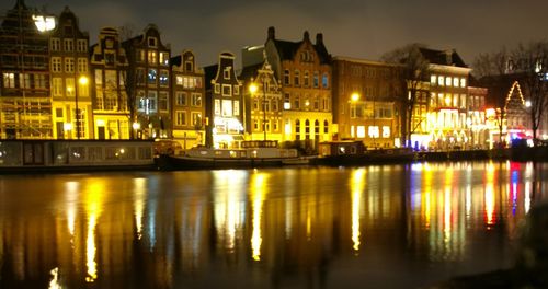 Reflection of illuminated buildings in water at night