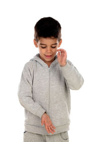 Smiling boy standing against white background