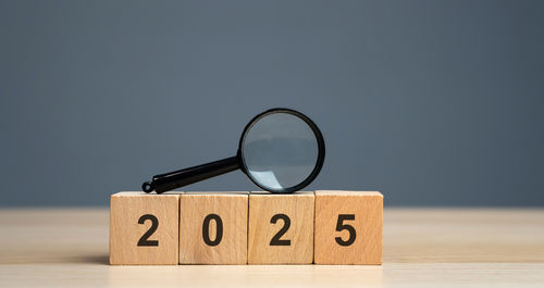 Close-up of magnifying glass on table