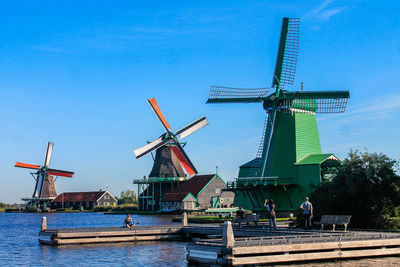 Traditional windmill against clear blue sky