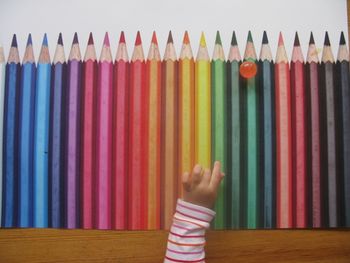 Close-up of multi colored pencils on table