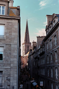 Buildings in city against sky