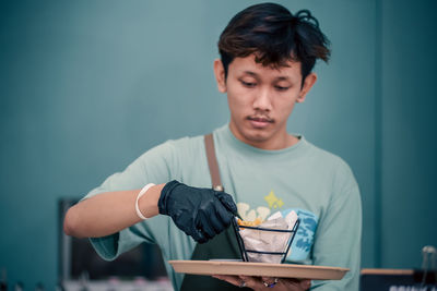 Young man using laptop at home