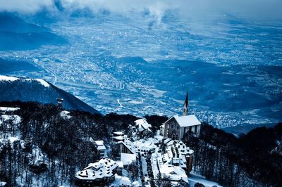 Scenic view of snow covered mountains against sky