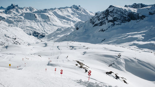 Aerial view of snowcapped mountain against sky