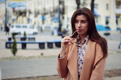 Portrait of beautiful woman standing outdoors