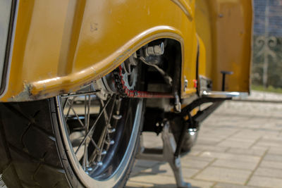 Close-up of motorcycle parked on street