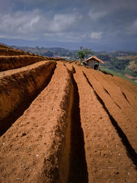 Panoramic view of road amidst land against sky