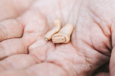 Close-up of person holding hands