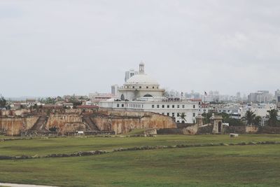 Buildings in city against sky