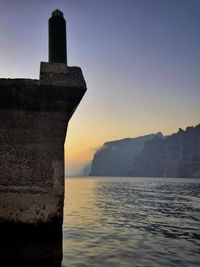 Scenic view of sea against clear sky during sunset