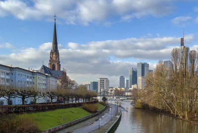 River amidst buildings against sky in city