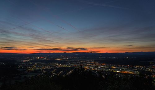 High angle view of illuminated buildings against sky during sunset