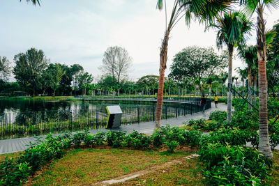 Scenic view of swimming pool by lake against sky