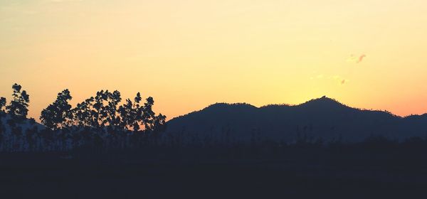 Scenic view of mountains at sunset