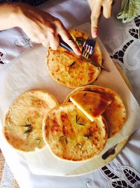 High angle view of woman preparing food in plate