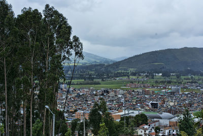 Houses in town against sky