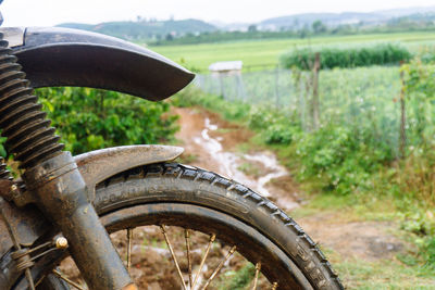 View of old bicycle wheel on field