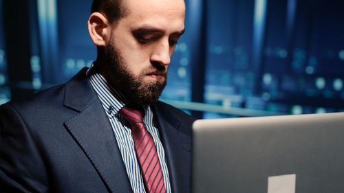 Young man looking at laptop