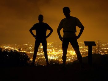 Silhouette people at sunset