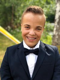 Portrait of young man standing outdoors