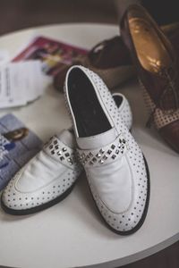 Close-up of shoes on table